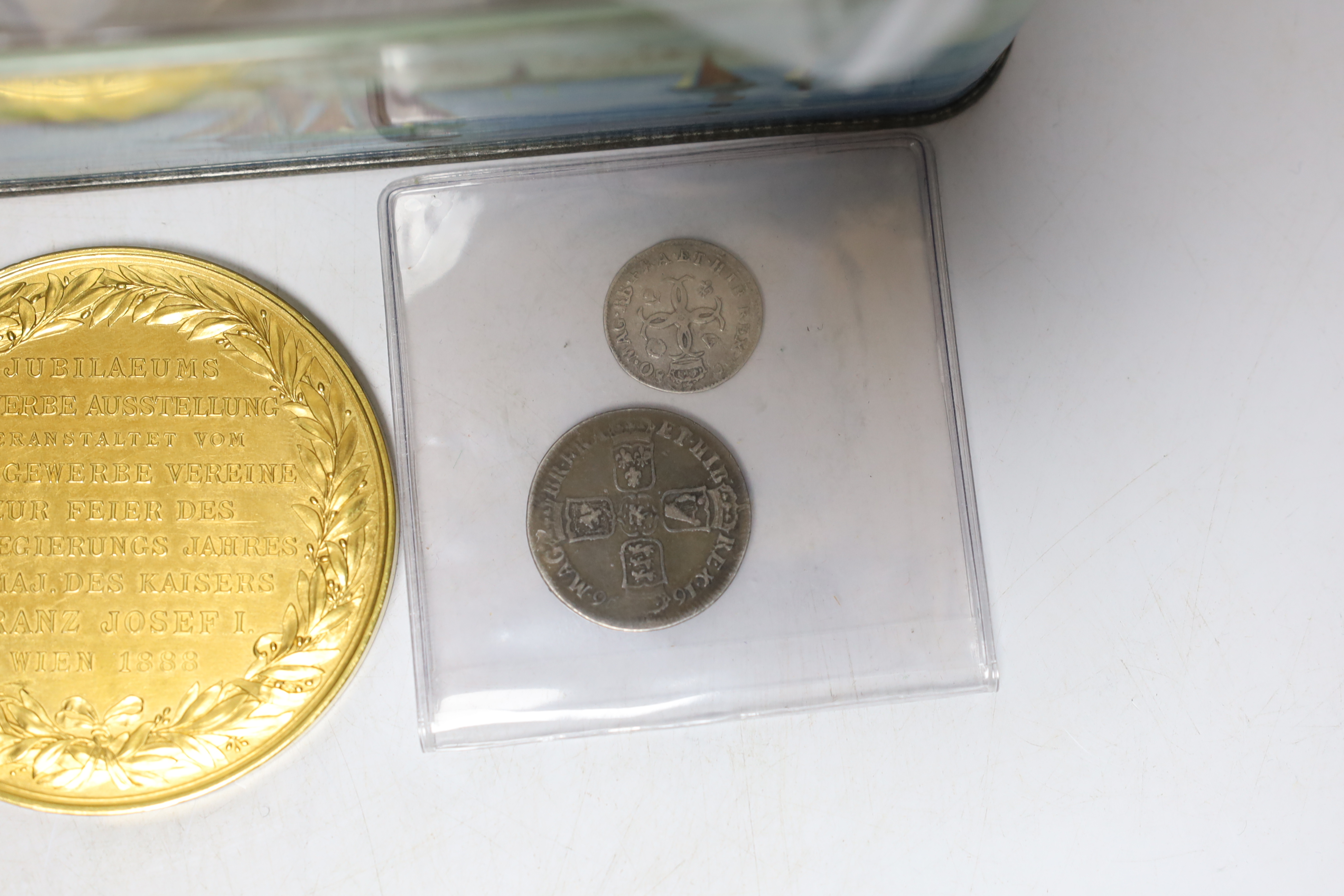 A collection of British coins including Charles II four pence 1680, William III shilling 1696, George III shilling 1787, various pennies, commemorative medals including Franz Joseph I 40th anniversary of his reign
